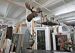 A view of the main floor with a moose head high on a column.