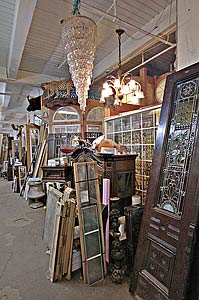 A chandelier hangs above an assortment of antiques and other collectibles