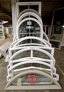 Photo of several windows with unusual shapes.